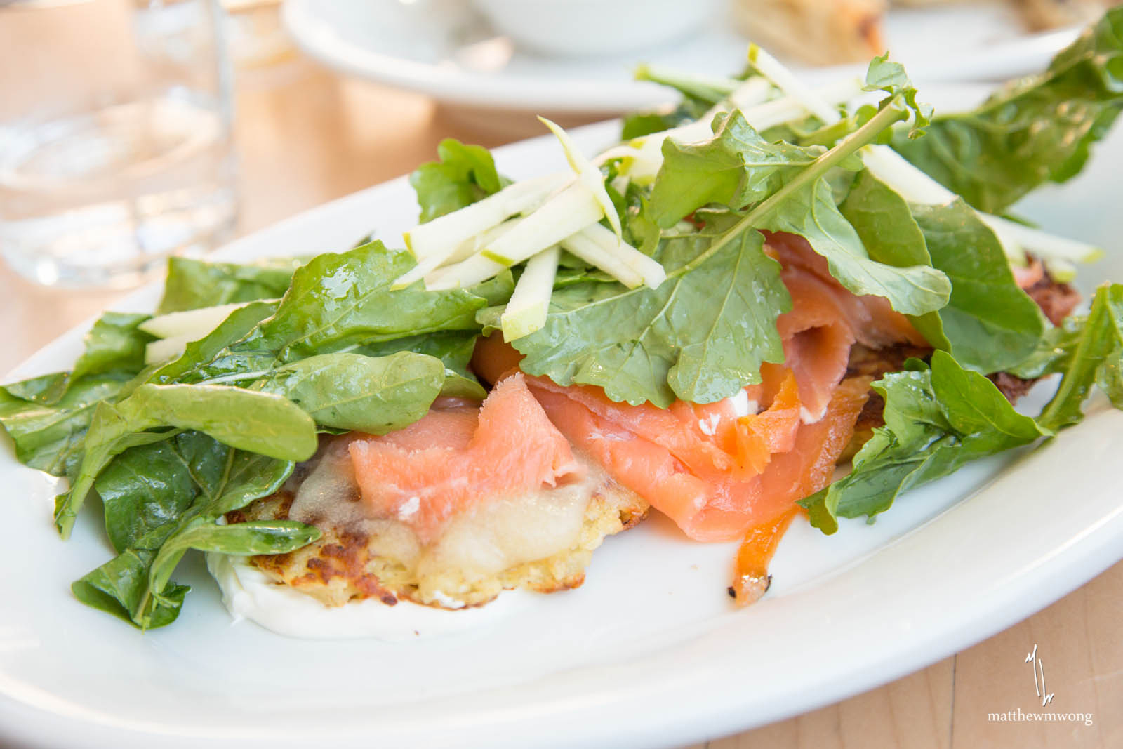 Fish and Potatoes - smoked salmon over latkes, sour cream, apples, arugula, lemon