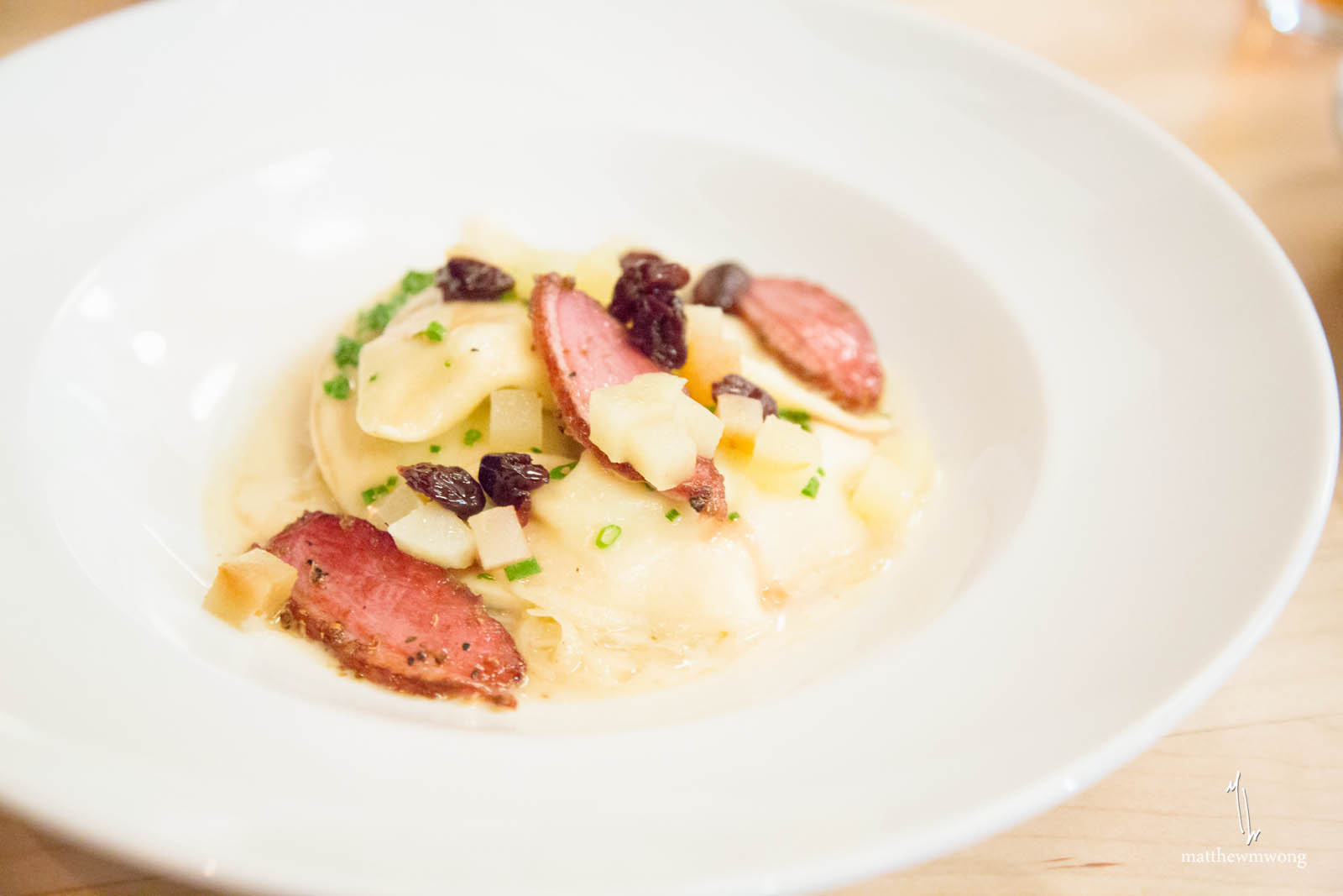 Potato Pierogi, duck pastrami, house fermented sauerkraut, granny smith apples