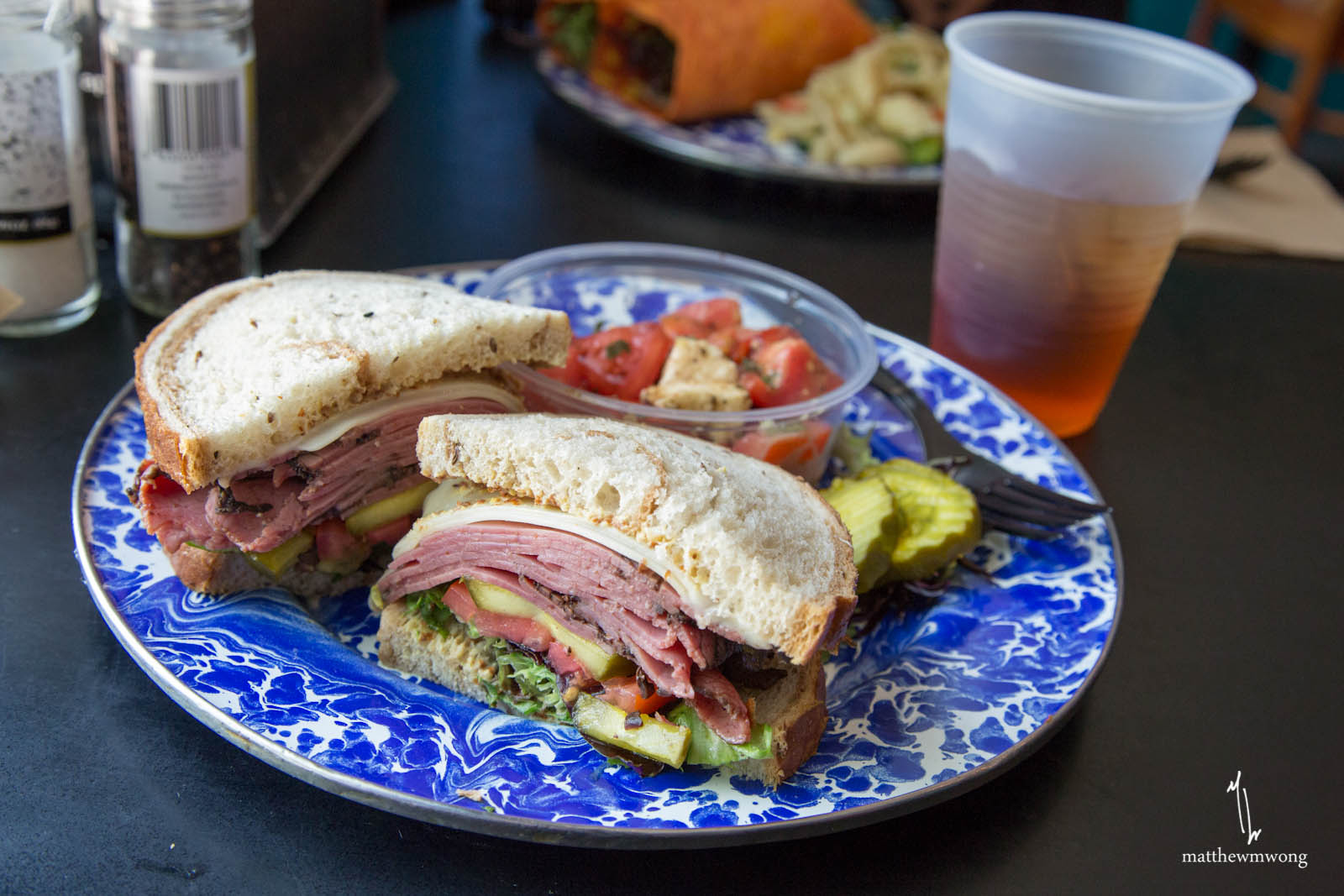 Cafe Sandwich, Mixed greens, tomatoes, and pesto mayo on focaccia with your choice of meat & cheese: roast beef & cheddar