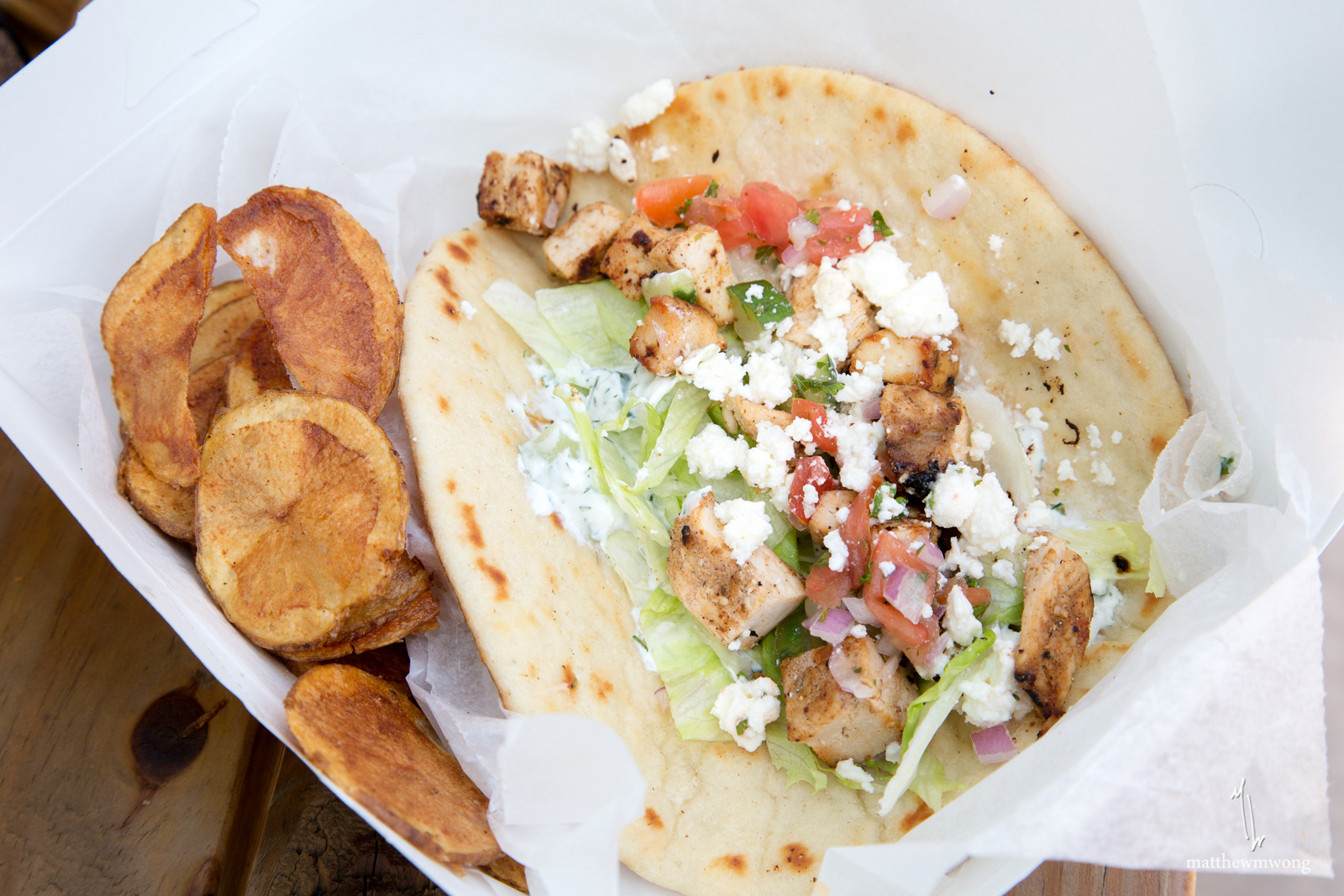 Chicken Shwarma, tzataziki, marinated grilled chicken breast, mediterranean salsa, lettuce, feta, on pita