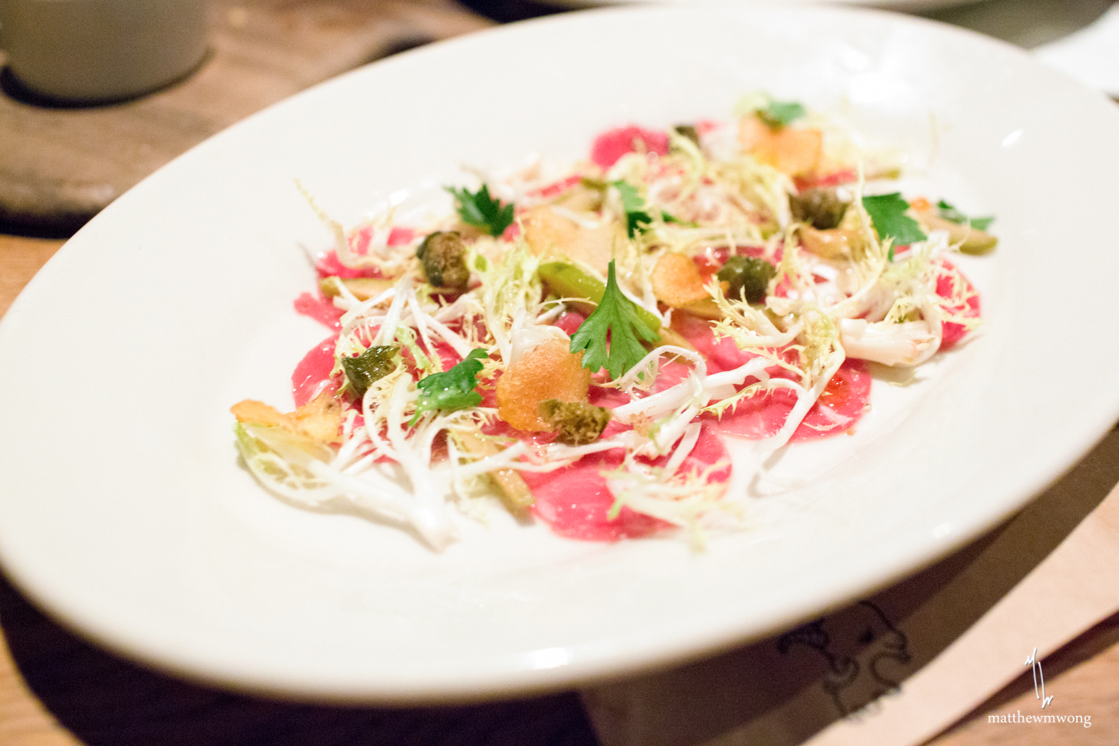 goat carpaccio, tongue-olive vinaigrette, smoked roe