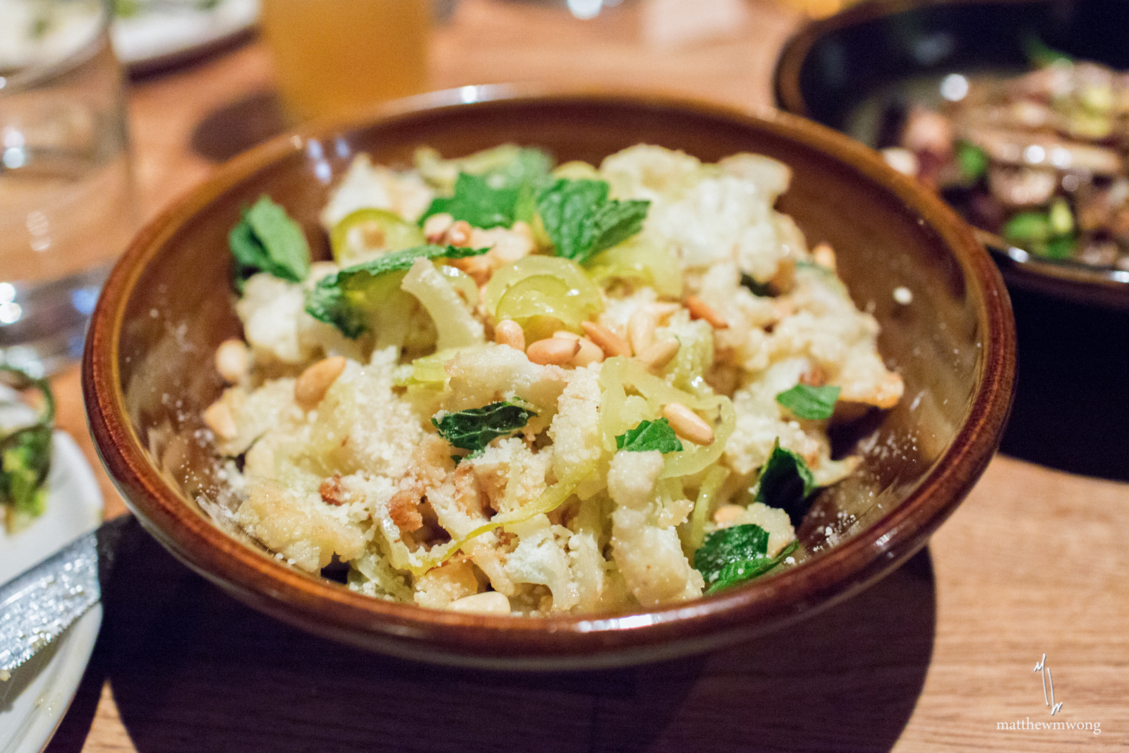 roasted cauliflower, pickled peppers, pine nuts, mint