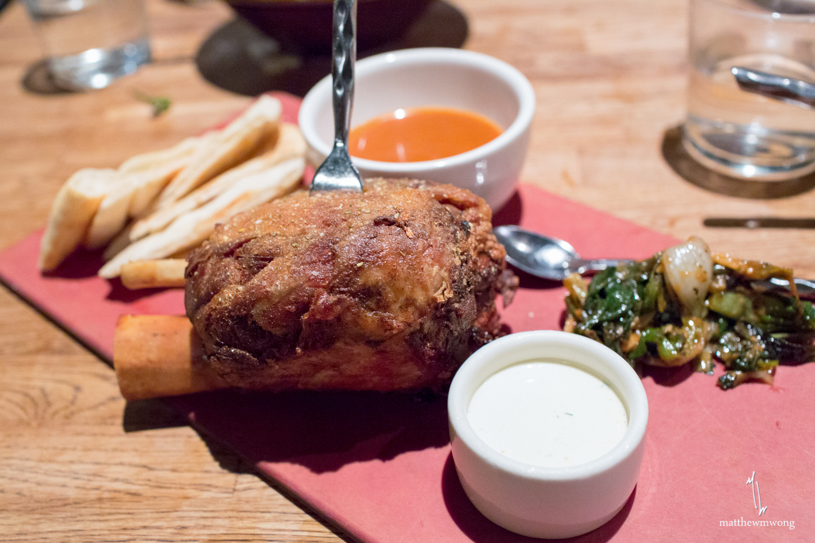 Crisp braised pork shank, grilled spring onion kimchee, buttermilk dressing, naan