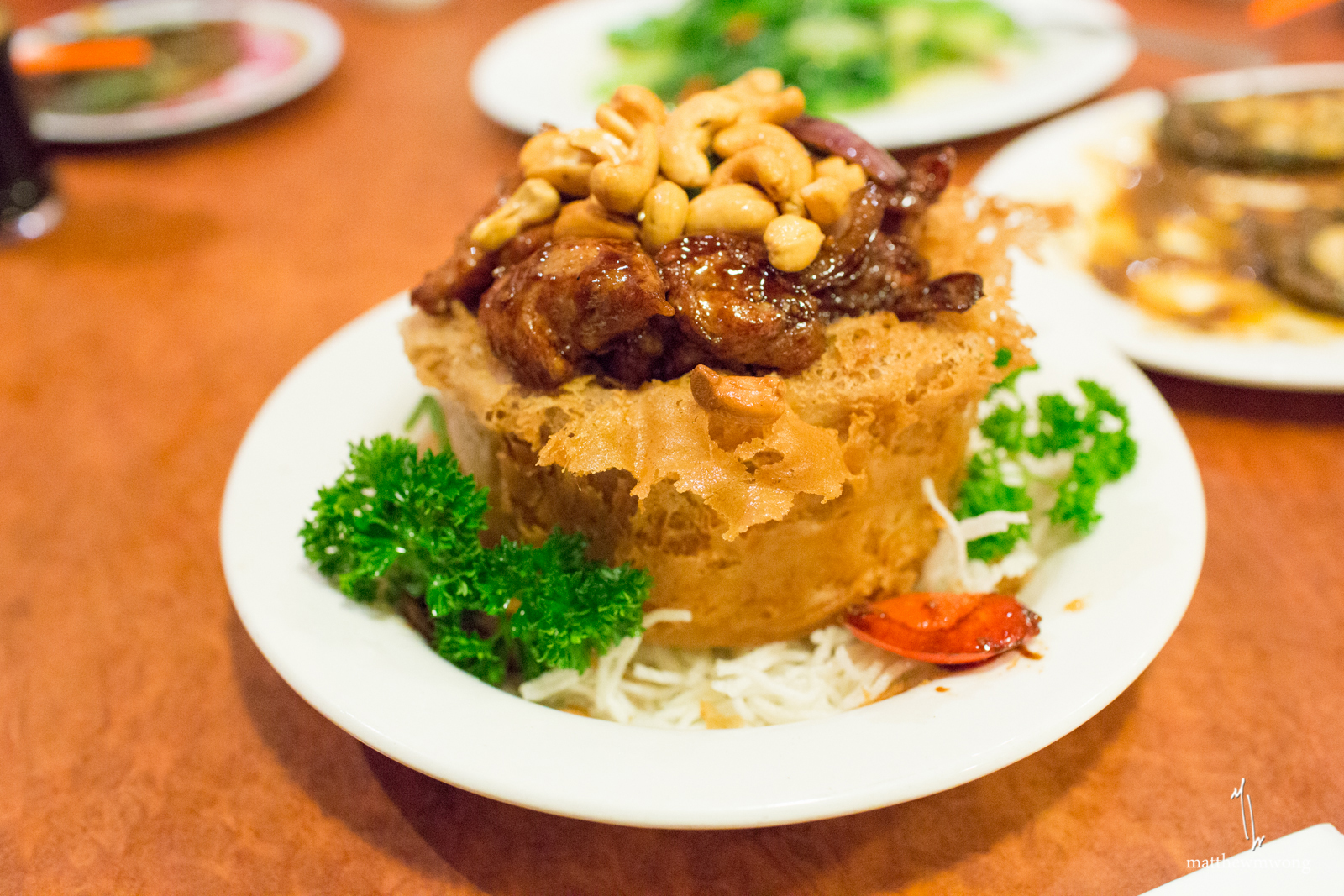 Chicken Yam Pot, Deep fried yam ring filled with stir fried chicken, vegetables, and cashew nuts