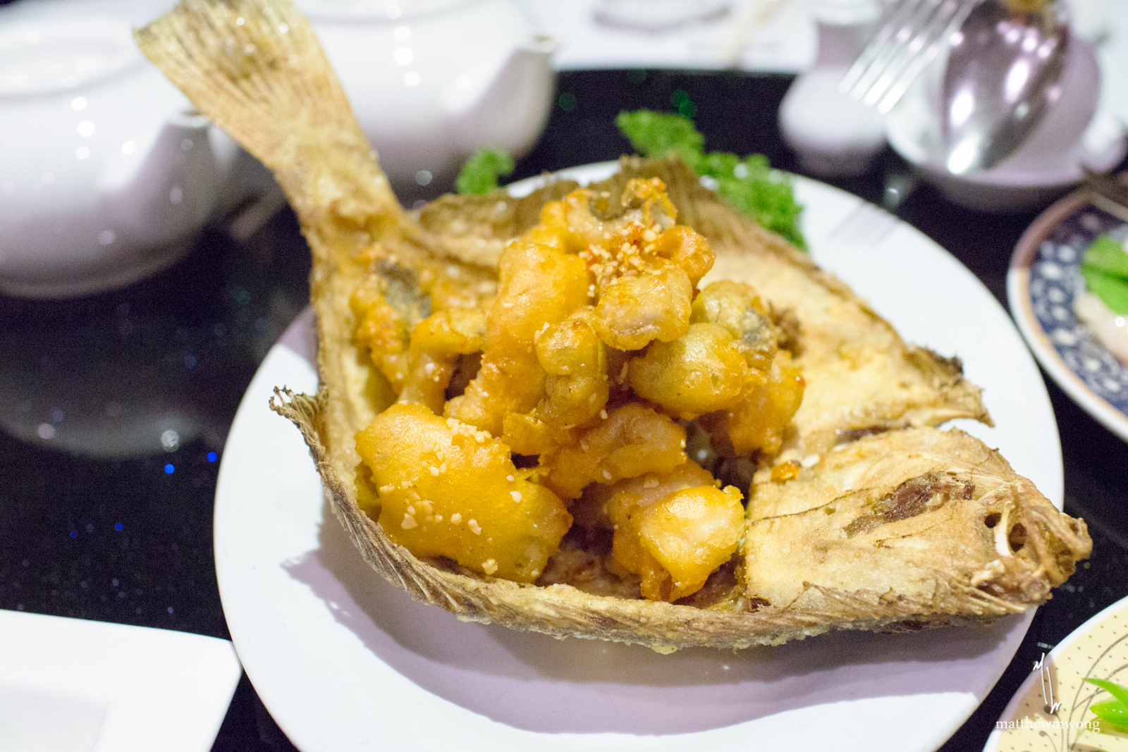 Salt and Chilli Flounder, Filleted lightly battered then wok-tossed with garlic, chilli and sea salt, served on a Fish Bone Basket