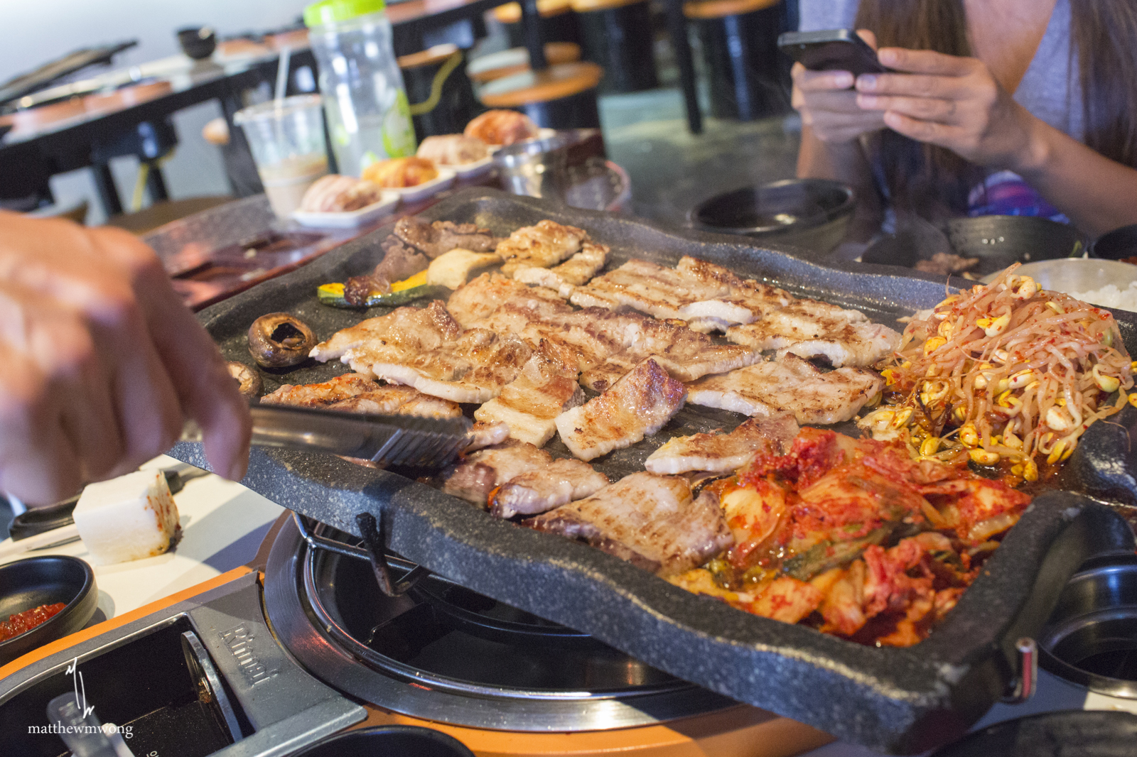 Full service Korean BBQ. Grills, cuts, replenishes your panchan, and fills up your drink quite regularly! Great service.