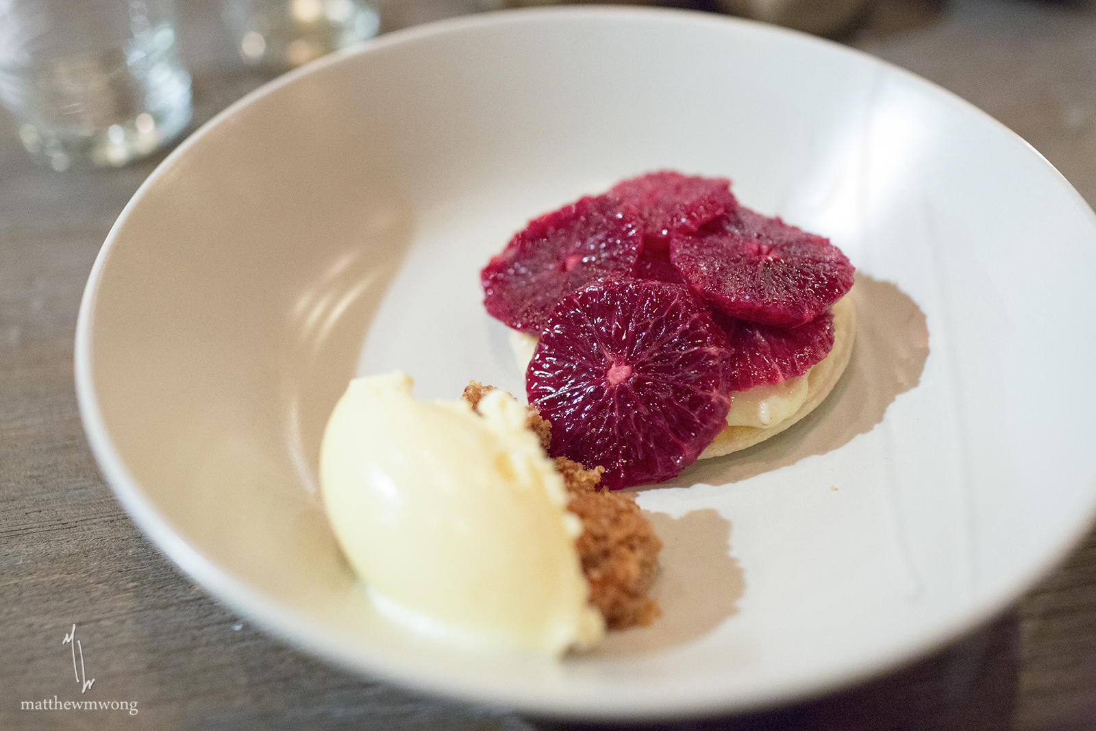 Blood orange tart, honey ice cream, spiced pecan praline