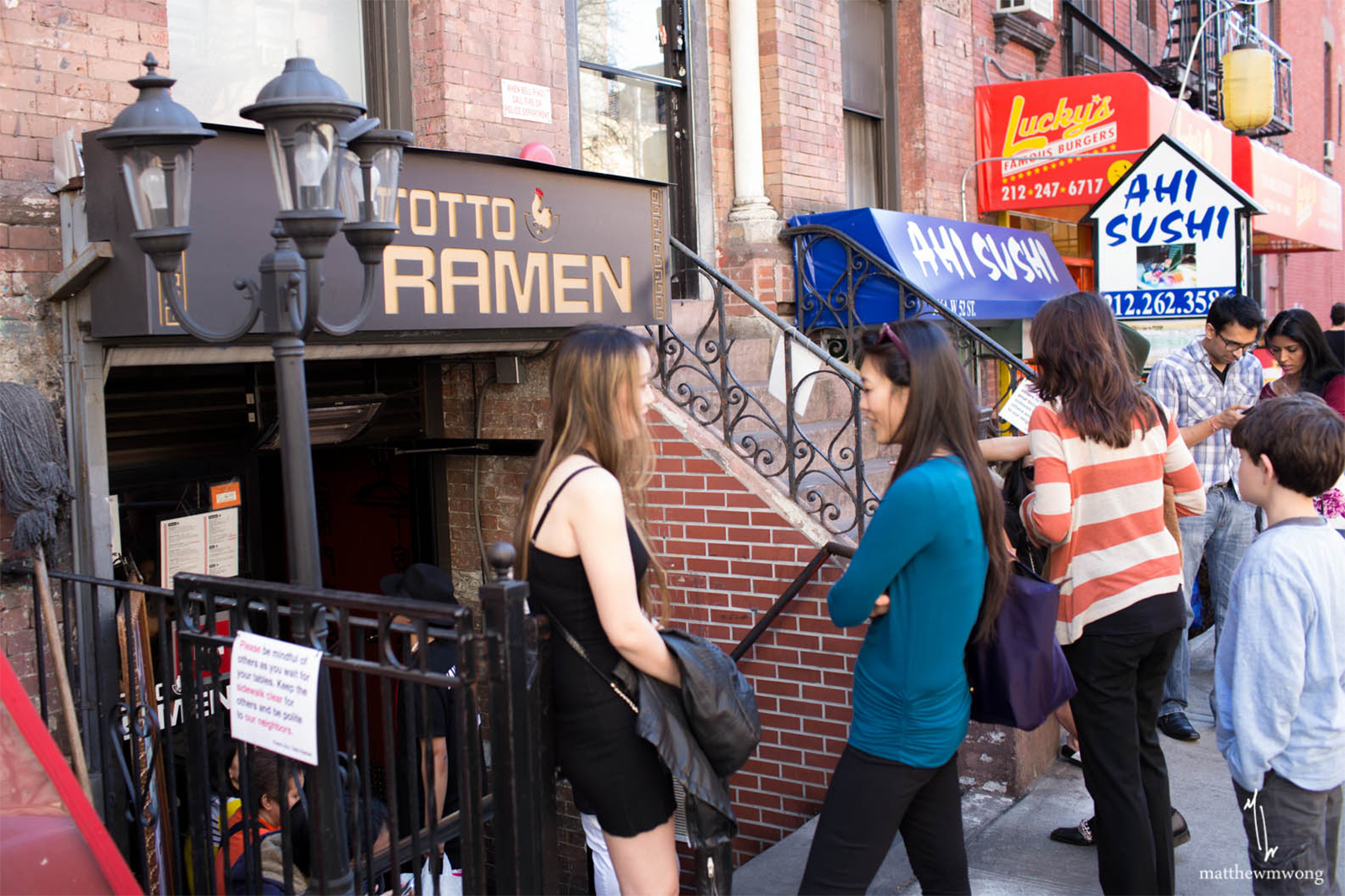 Outside waiting. Make sure to sign your name on the clip board; Totto Ramen's system to determine who is next to be seated.