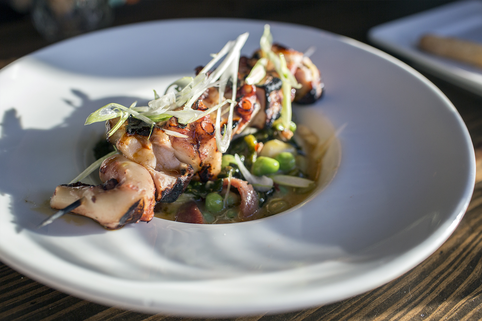 Octopus & mortadella spiedino, shell beans, escarole, marsala