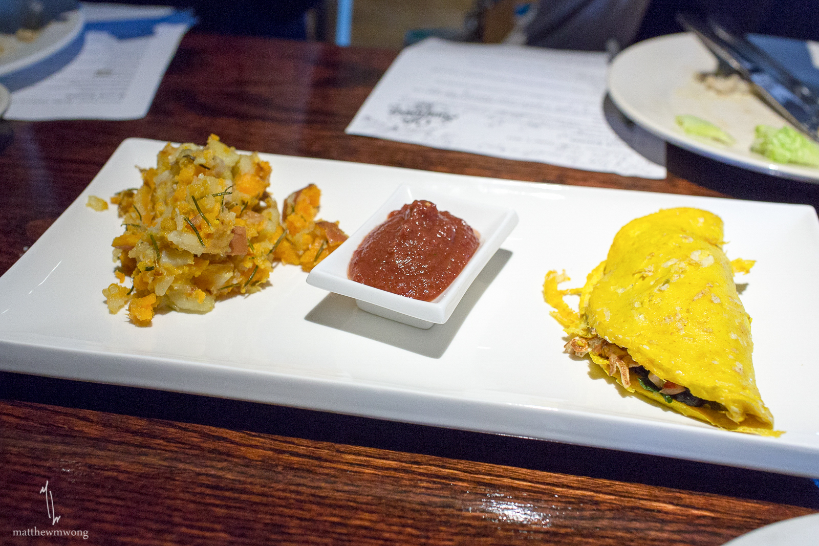 Tofu Omelette - Sauteed oyster mushroom, onions, peppers, zucchini, country-style home fries and vegan hollandaise