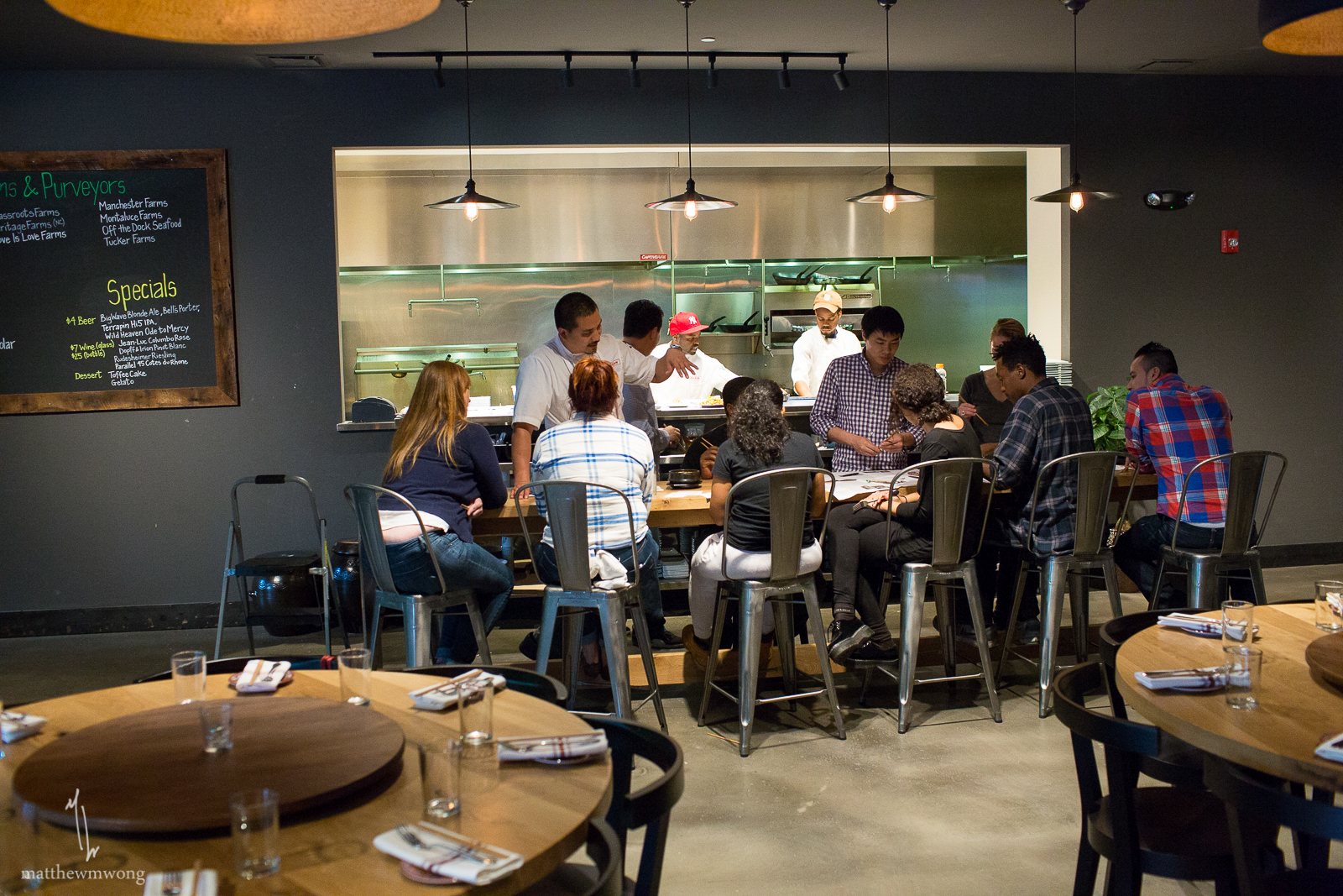 Chef George Yu educating staff on new dishes